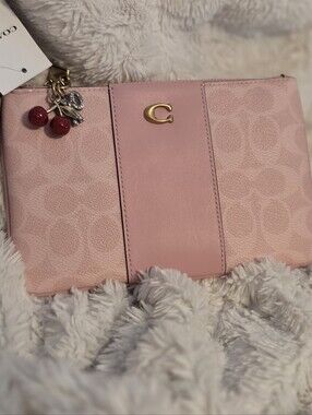 Coach Pink Leather Wristlet with Cherry Charm Accent